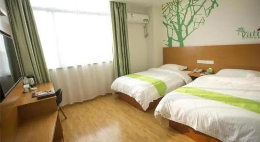 Bed in Vatica Tianjin Jinghai Bus Station Home World Plaza Hotel