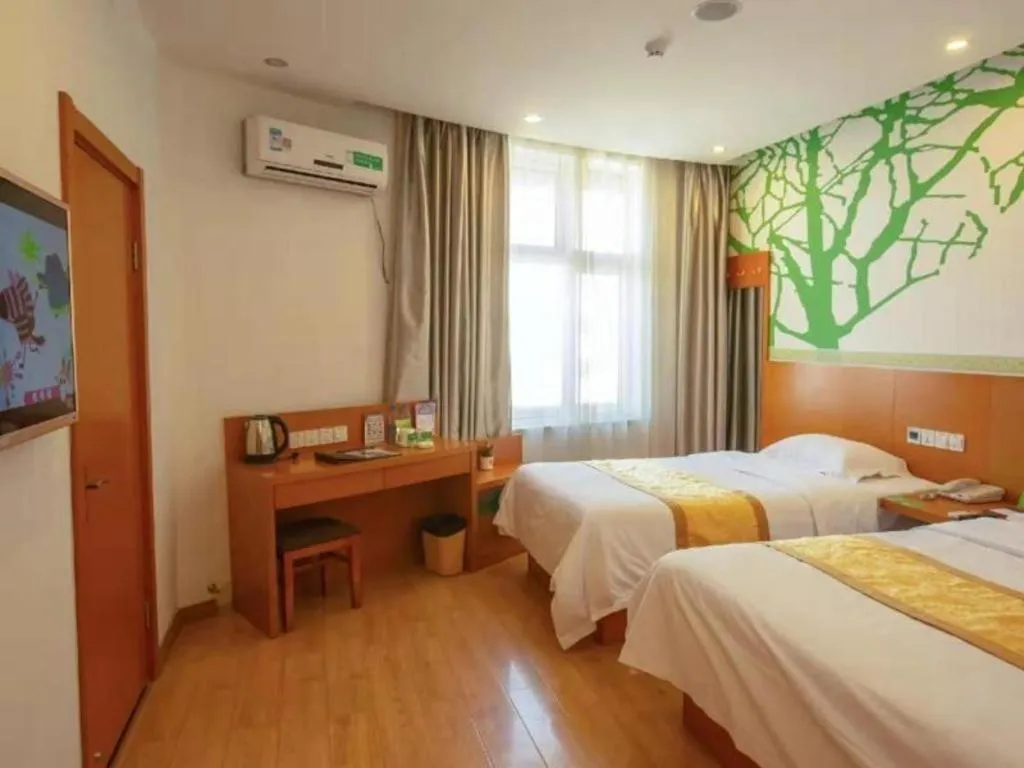 Bed in Vatica Tianjin Jinghai Bus Station Home World Plaza Hotel