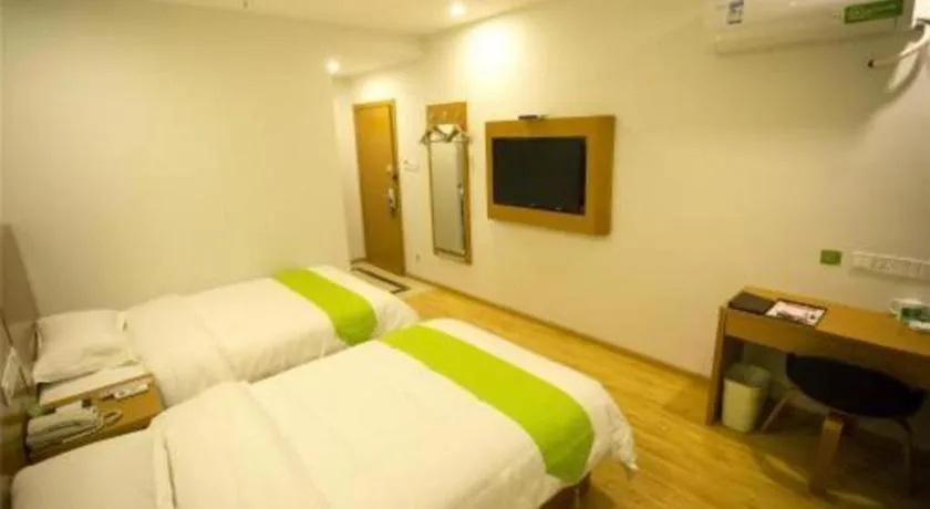 Bed in Vatica Tianjin Jinghai Bus Station Home World Plaza Hotel