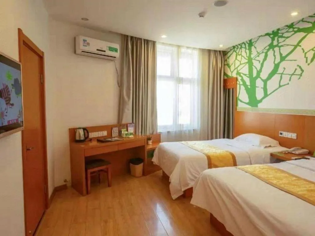 Bed in Vatica Tianjin Jinghai Bus Station Home World Plaza Hotel