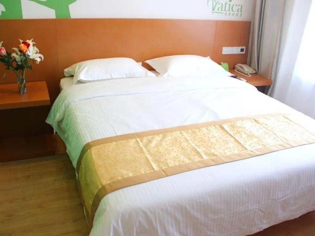 Bed in Vatica Tianjin Jinghai Bus Station Home World Plaza Hotel
