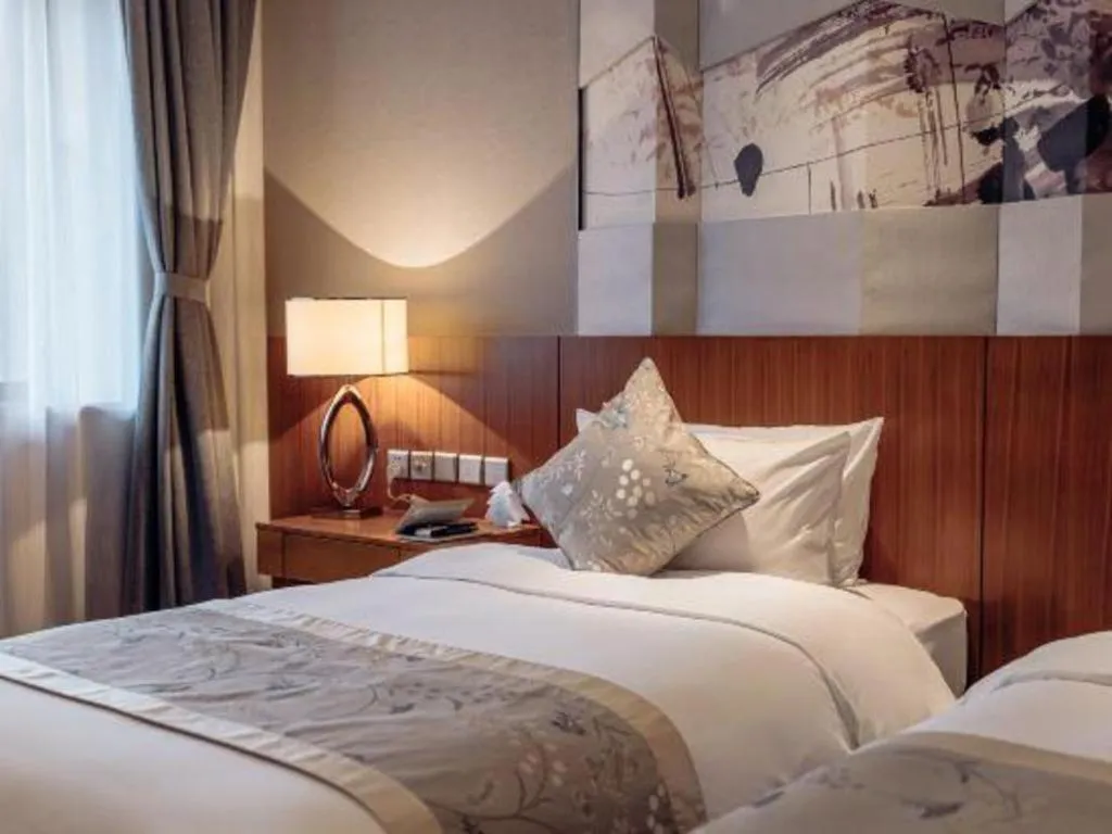 Bed in CITIC Jinling Hotel