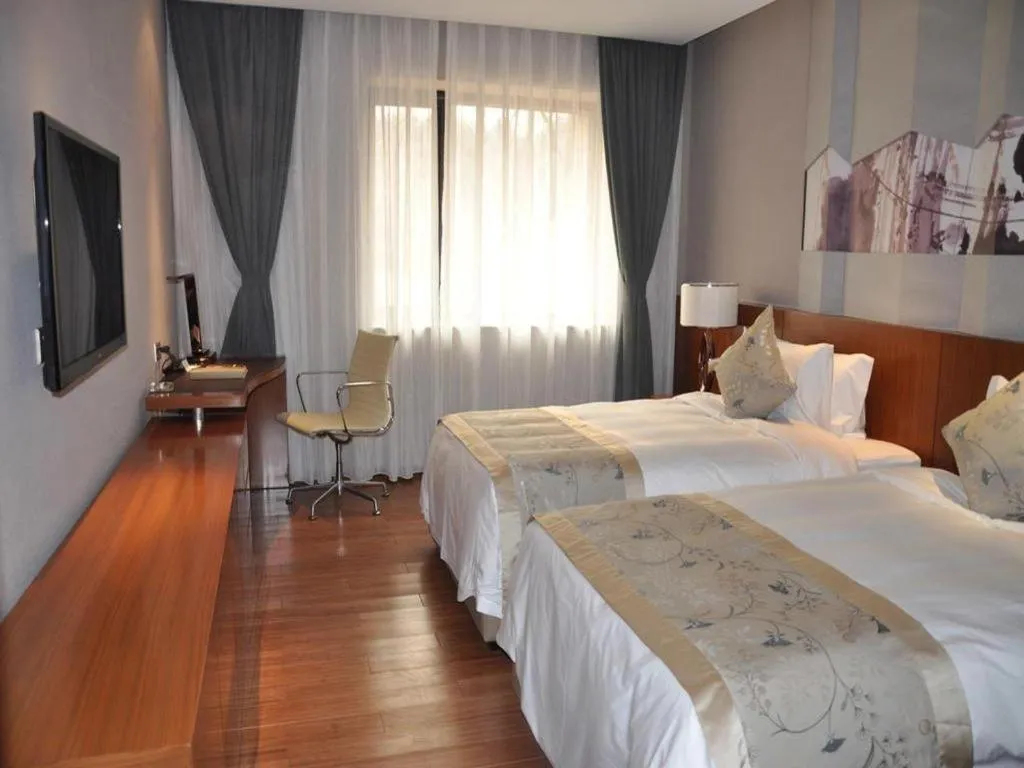 Bed in CITIC Jinling Hotel