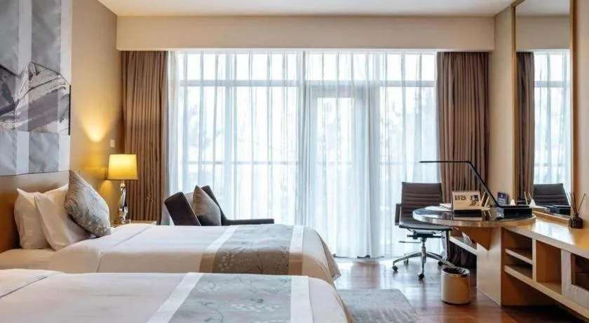 Bed in CITIC Jinling Hotel