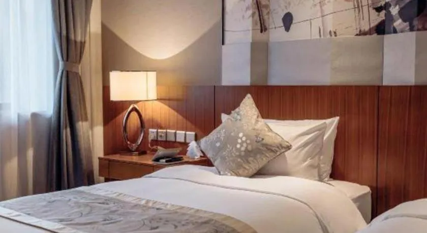 Bed in CITIC Jinling Hotel