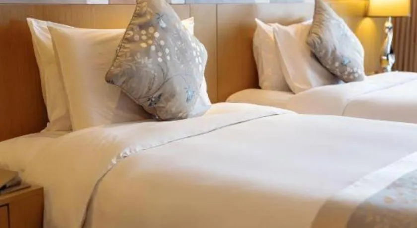 Bed in CITIC Jinling Hotel