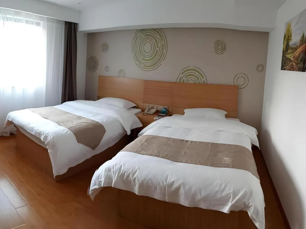 Bed in GreenTree Inn Anqing Qianshan County Sunshine City Express Hotel