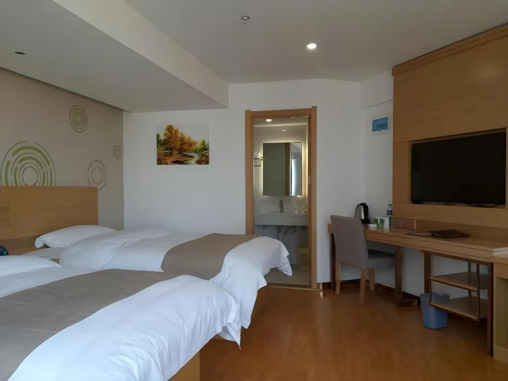 Bed in GreenTree Inn Anqing Qianshan County Sunshine City Express Hotel