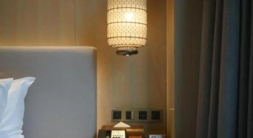 Bed in Jolie Vue Boutique Hotel Sanjiang