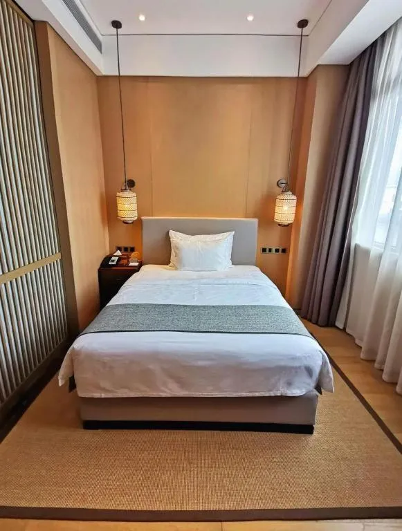 Bed in Jolie Vue Boutique Hotel Sanjiang