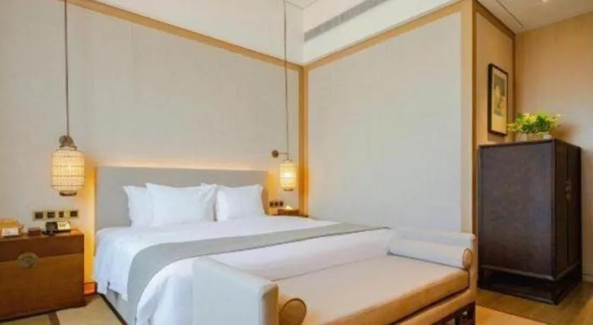 Bed in Jolie Vue Boutique Hotel Sanjiang