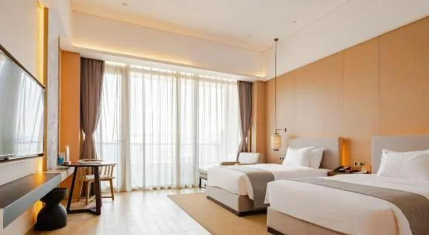 Bed in Jolie Vue Boutique Hotel Sanjiang