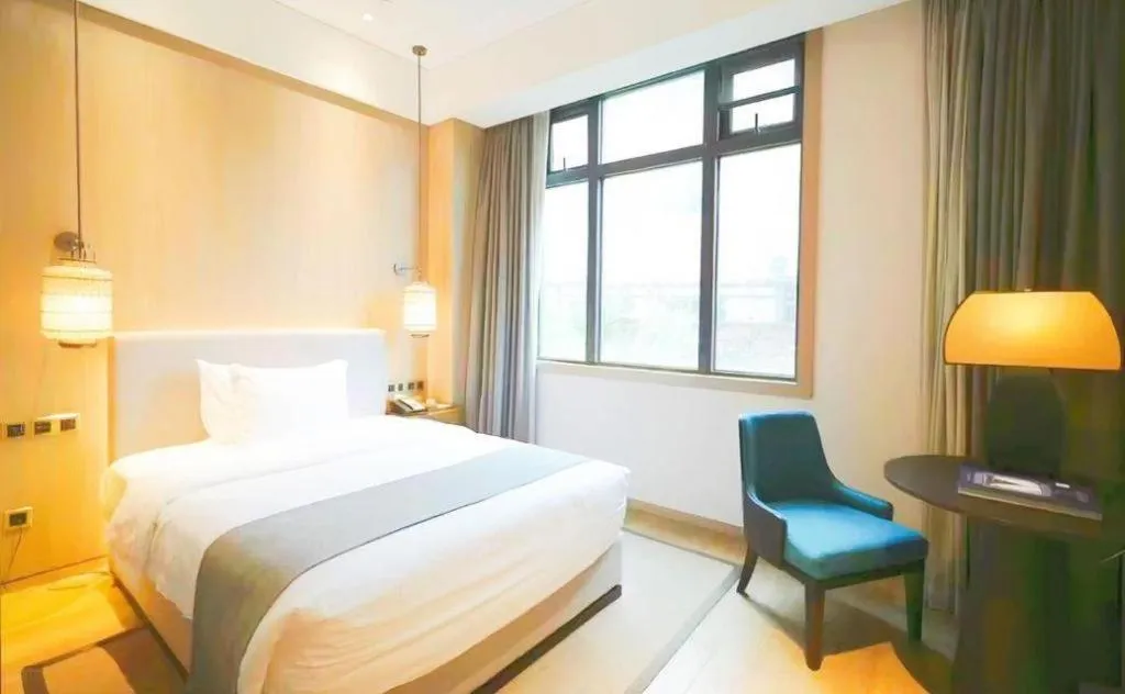 Bed in Jolie Vue Boutique Hotel Sanjiang