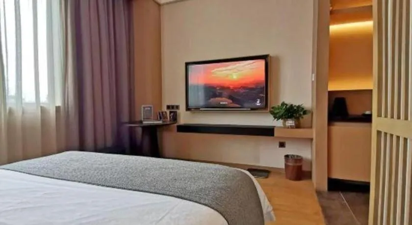 Bed in Jolie Vue Boutique Hotel Sanjiang