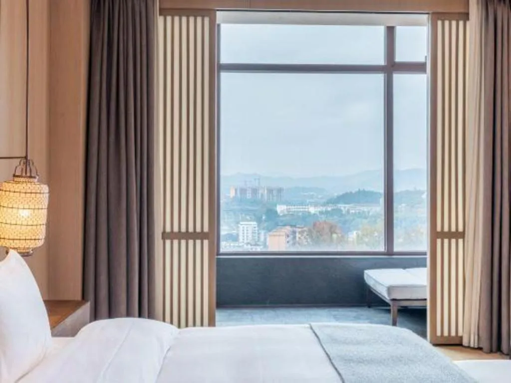 Bed in Jolie Vue Boutique Hotel Sanjiang