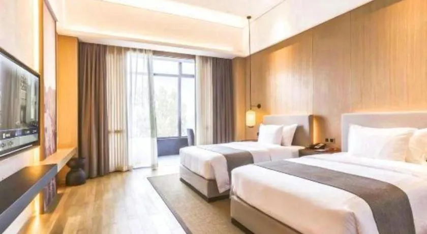Bed in Jolie Vue Boutique Hotel Sanjiang