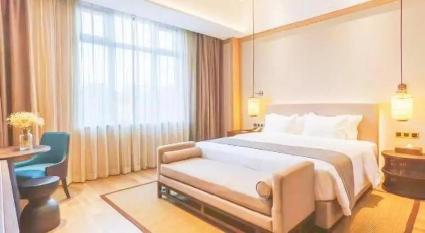 Bed in Jolie Vue Boutique Hotel Sanjiang