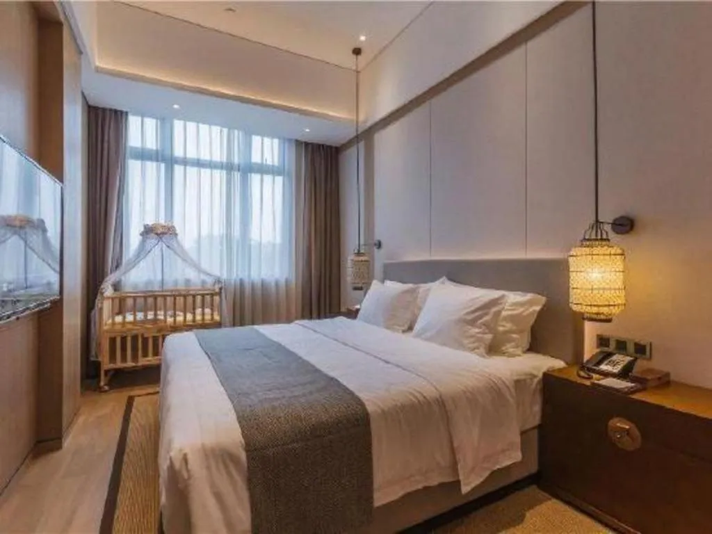 Bed in Jolie Vue Boutique Hotel Sanjiang