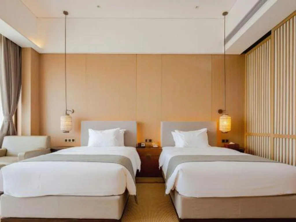 Bed in Jolie Vue Boutique Hotel Sanjiang