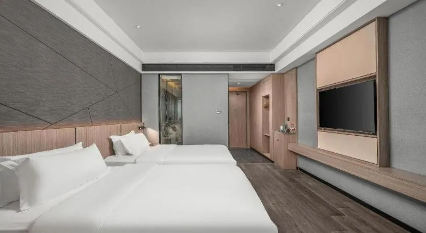 Bed in ibis Styles Dongguan Chang-an Wanda Plaza Hotel