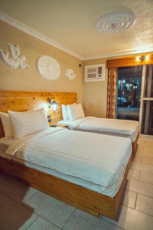 Bed in Roman Empire Panglao Boutique Resort