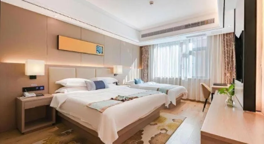 Bed in GreenTree Eastern Dali Railway Station Hotel