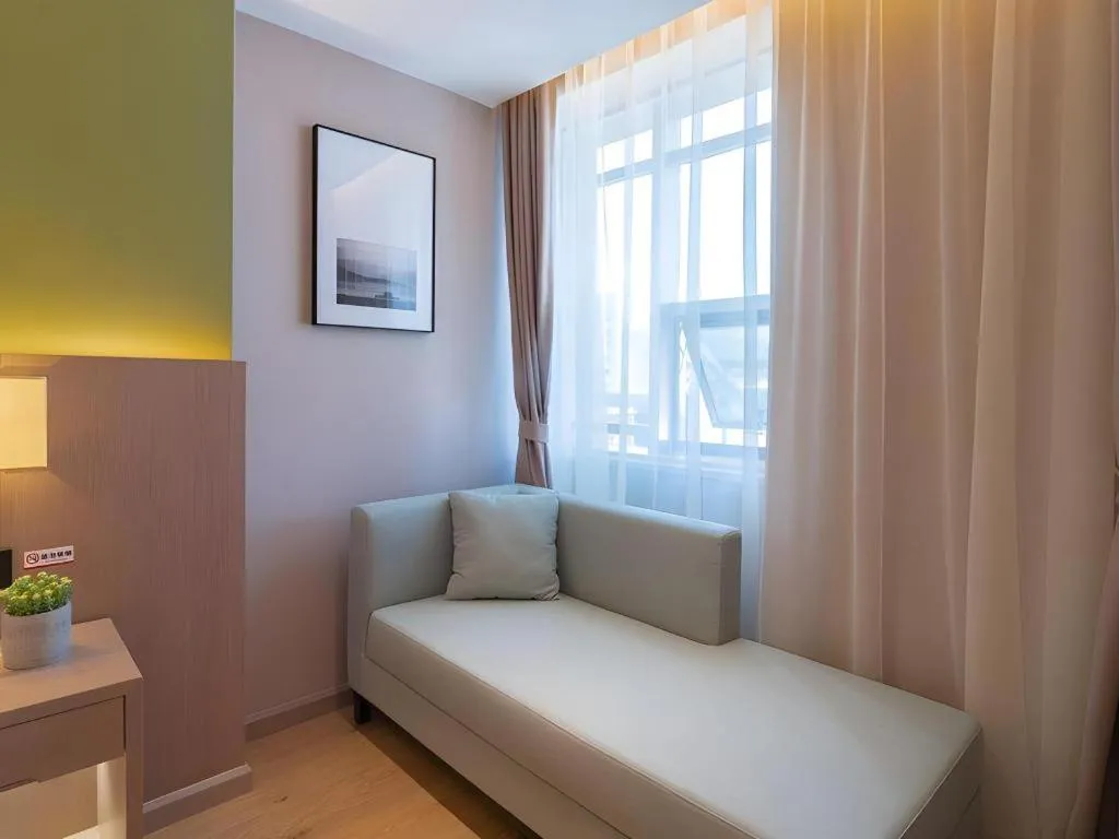 Bed in GreenTree Eastern Dali Railway Station Hotel