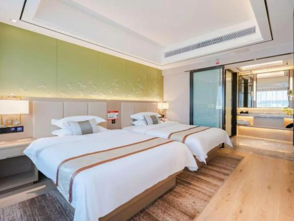 Bed in GreenTree Eastern Dali Railway Station Hotel