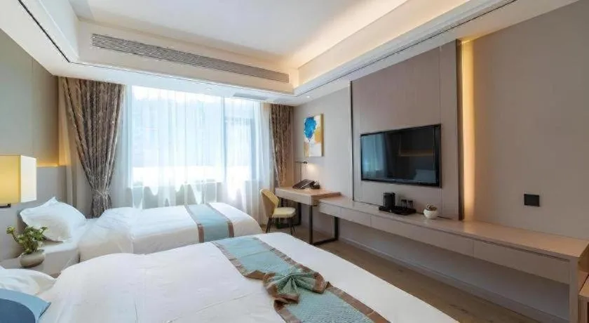 Bed in GreenTree Eastern Dali Railway Station Hotel