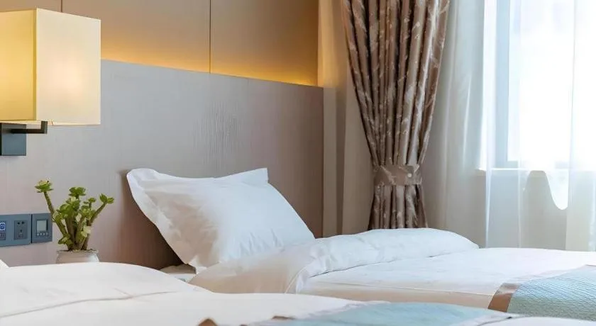 Bed in GreenTree Eastern Dali Railway Station Hotel