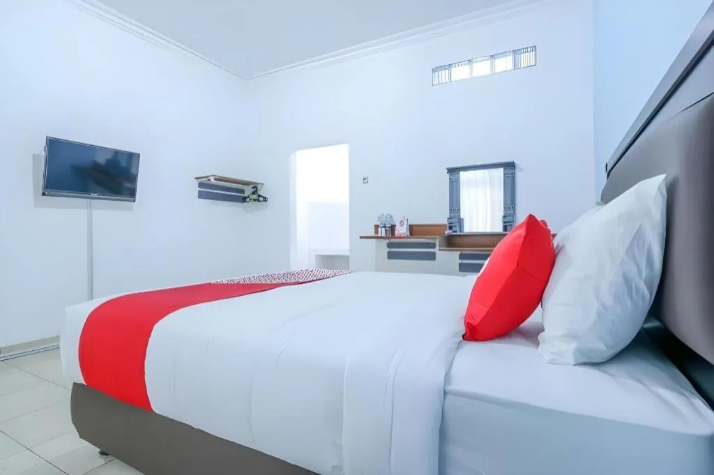 Bed in OYO 1755 De'balcon Accomodation Near Ngurah Rai Airport
