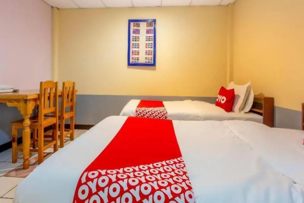 Bed in OYO 1000 Maetang Hotel