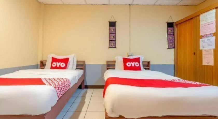 Bed in OYO 1000 Maetang Hotel