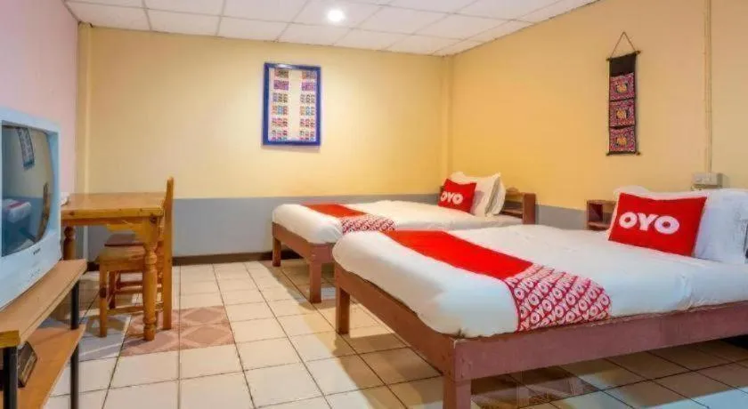 Bed in OYO 1000 Maetang Hotel