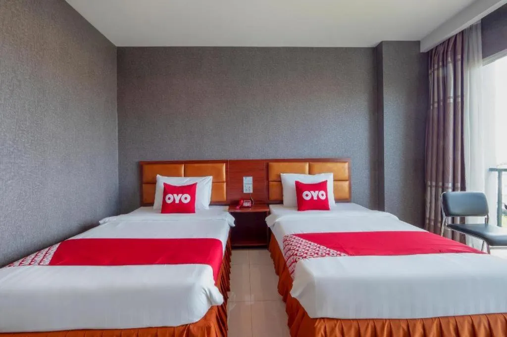 Bed in OYO 1130 CK Resort Pattaya