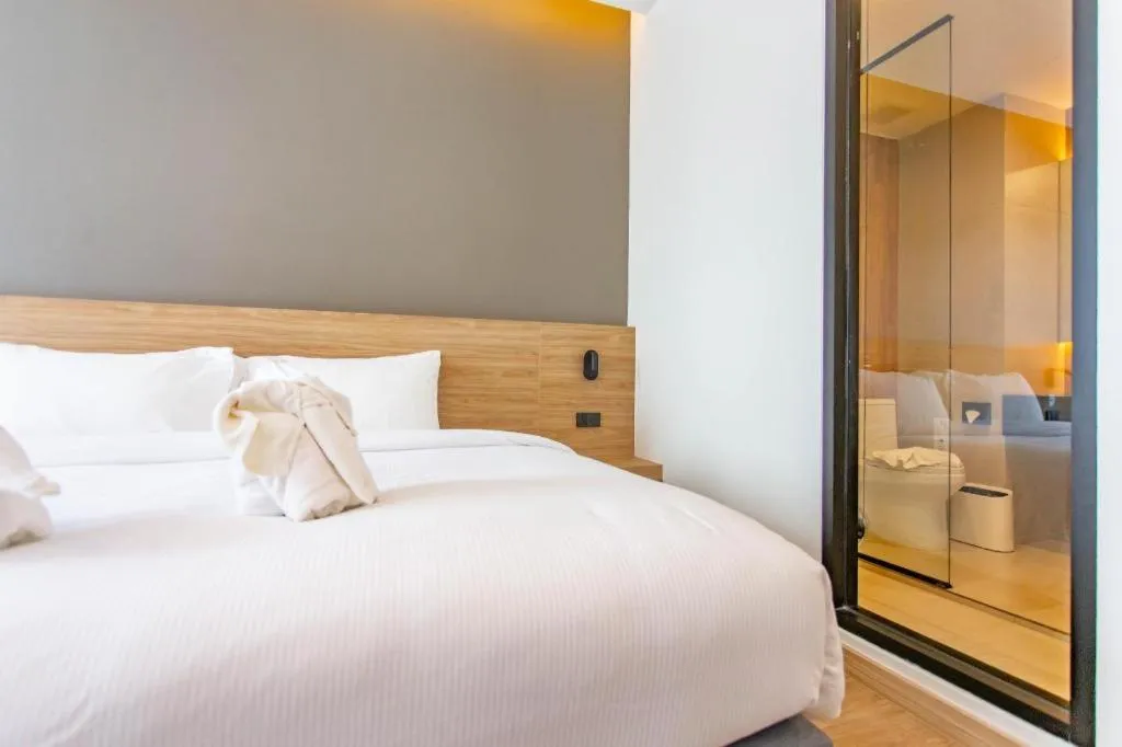 Bed in Chewa Khong Hotel Nakhon Phanom