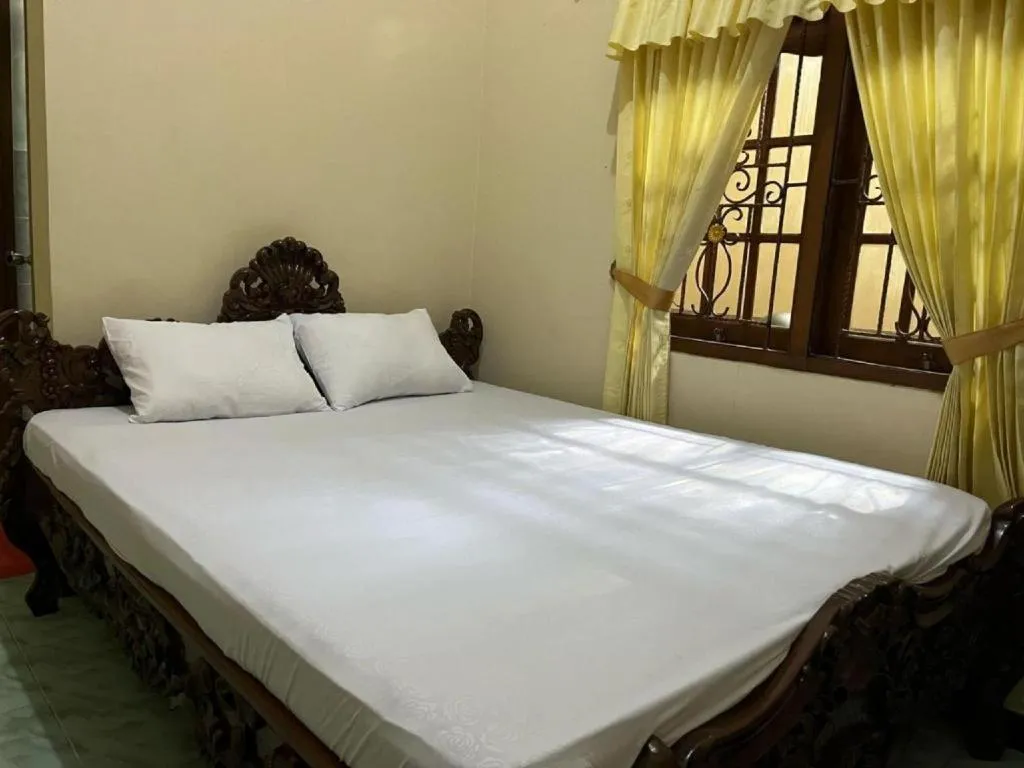 Bed in OYO 94003 Anjuk Ladang Homestay