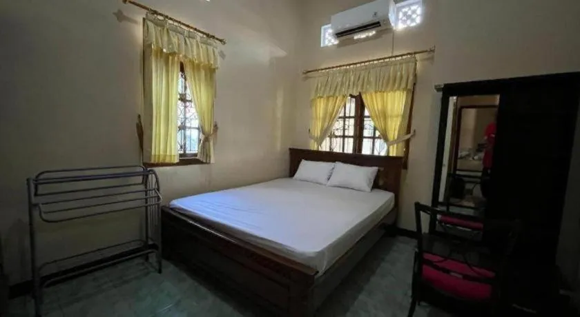 Bed in OYO 94003 Anjuk Ladang Homestay