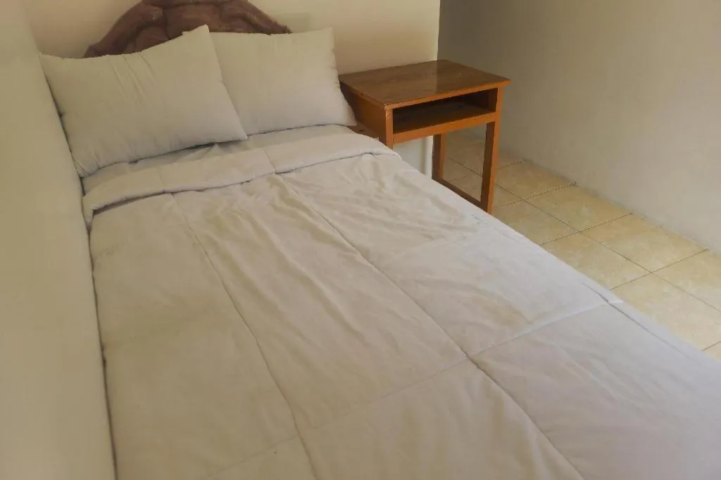 Bed in Hotel O Guest House Wijaya Syariah Near alun alun kota purwokerto