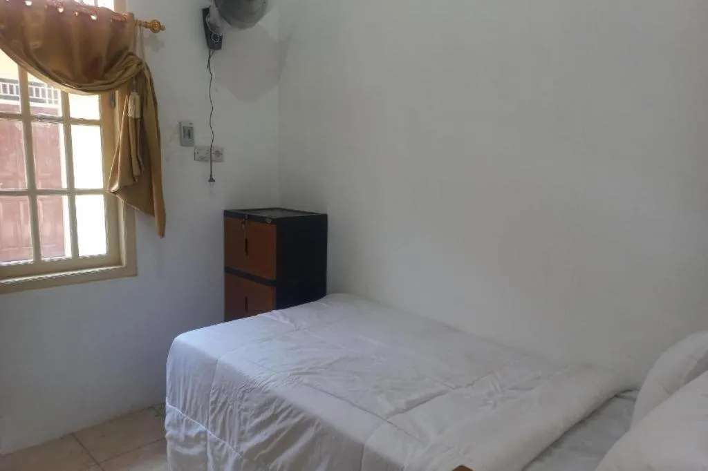 Bed in Hotel O Guest House Wijaya Syariah Near alun alun kota purwokerto