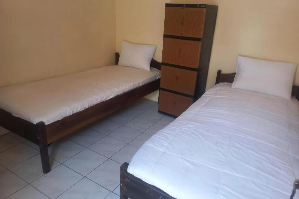 Bed in Hotel O Guest House Wijaya Syariah Near alun alun kota purwokerto