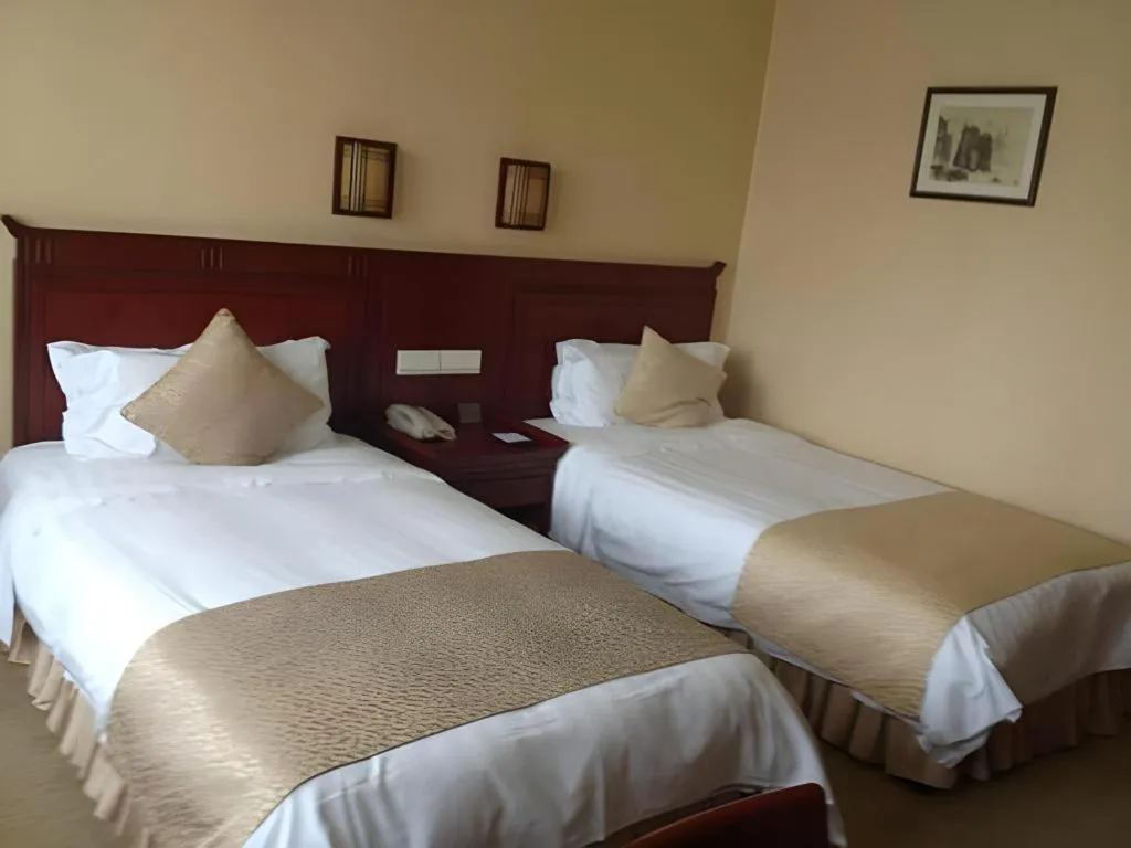 Bed in Meiyuan Hotel Hangzhou