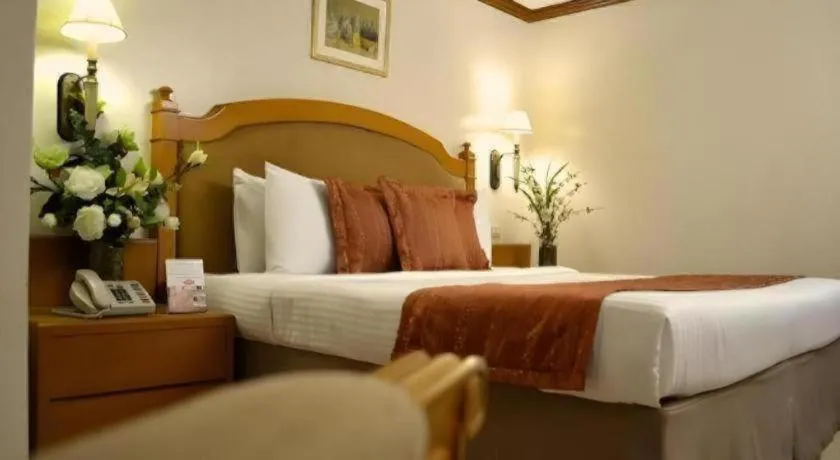 Bed in Palm Hotel Manila