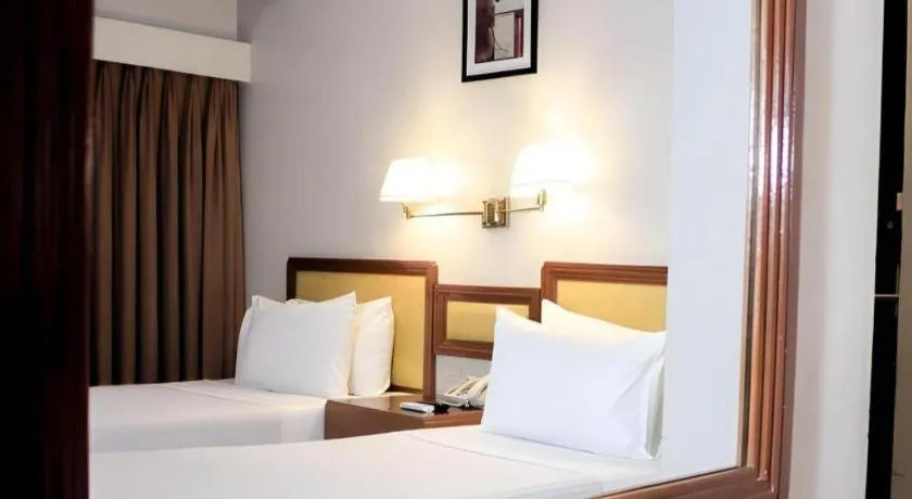 Bed in Palm Hotel Manila