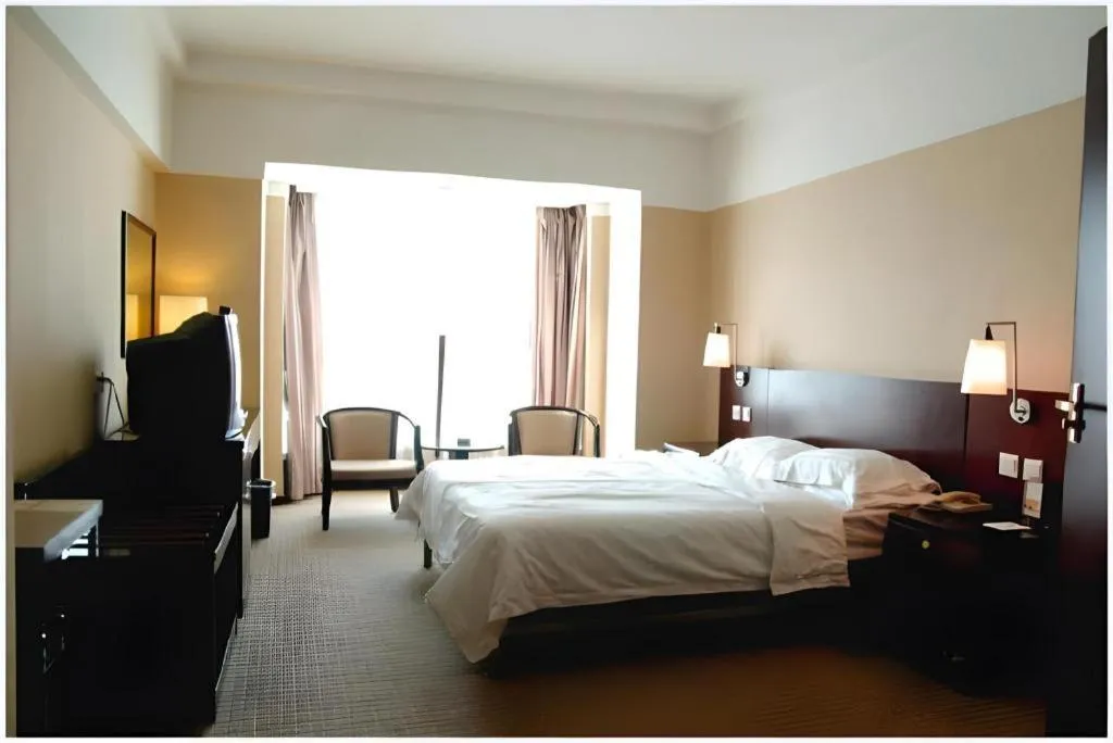 Bed in Dong Fang Hotel