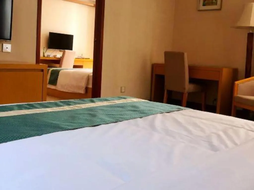 Bed in Xiamen Plaza Hotel