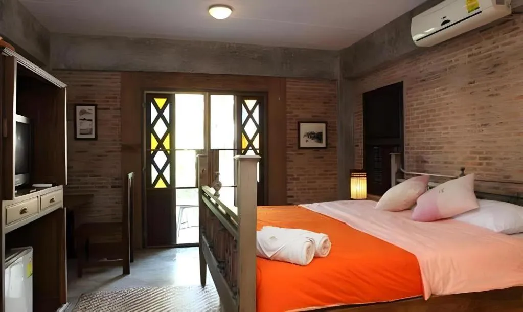 Bed in Baan Gong Kham Hotel