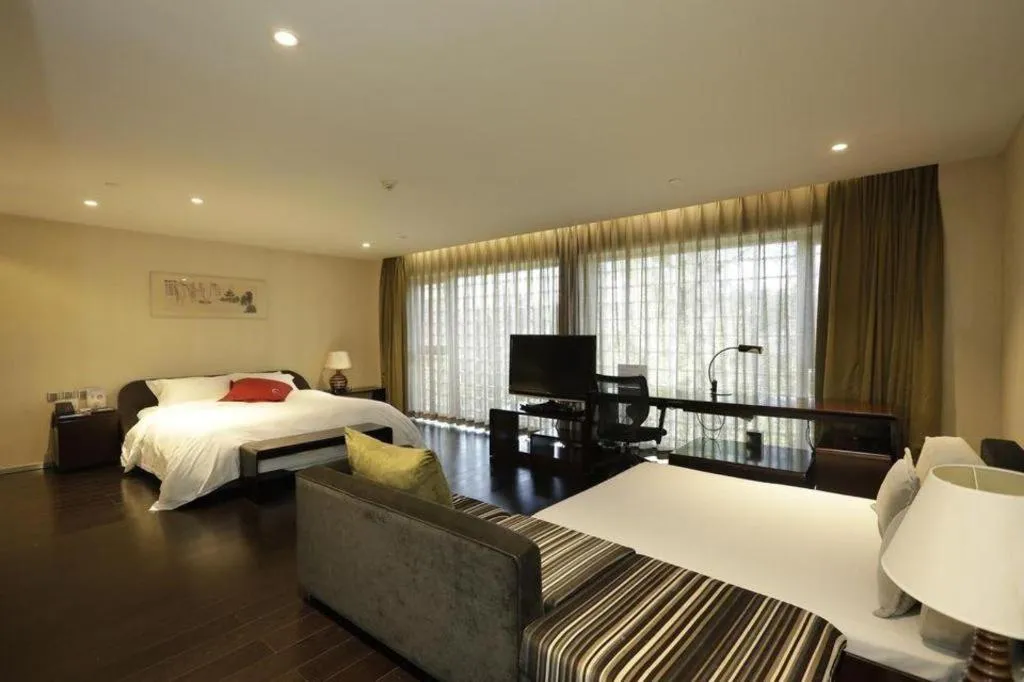 Bed in Hotel Kapok Wangfujing