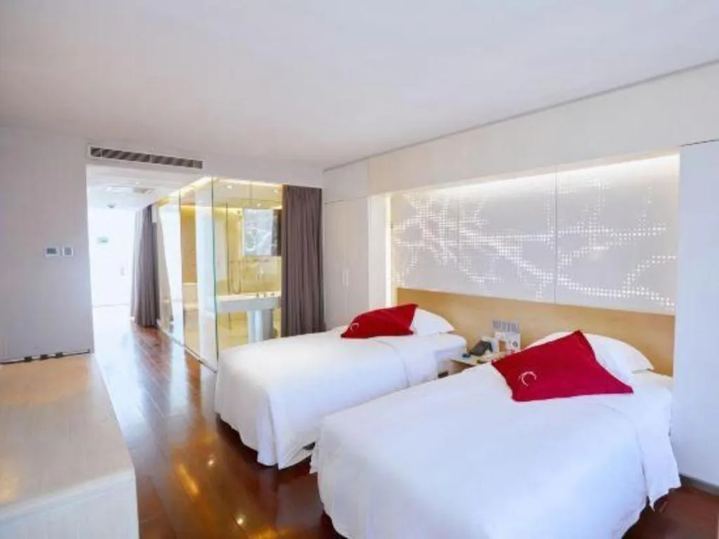 Bed in Hotel Kapok Wangfujing