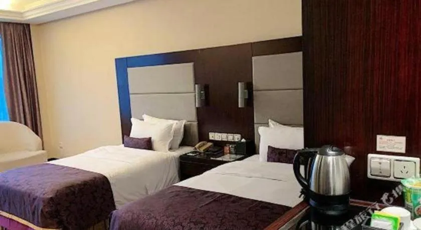 Bed in Yiwu Yimei Plaza Hotel